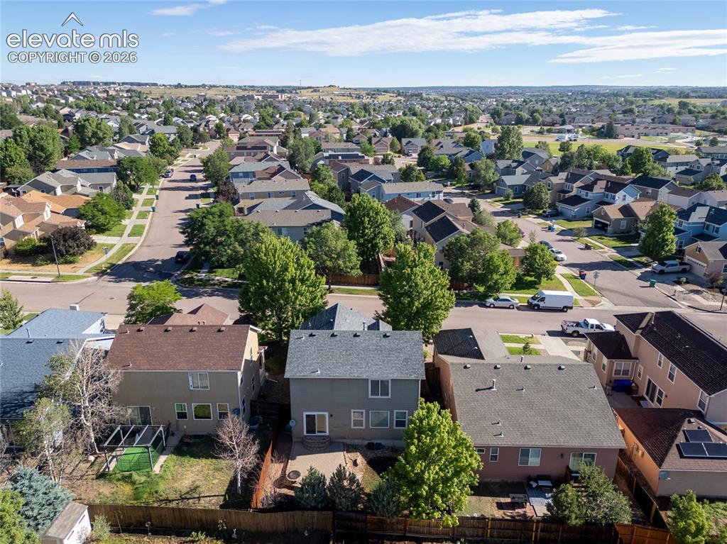 Image 34 of 39: Residential neighborhood featuring a grid-pattern street layout, establishe