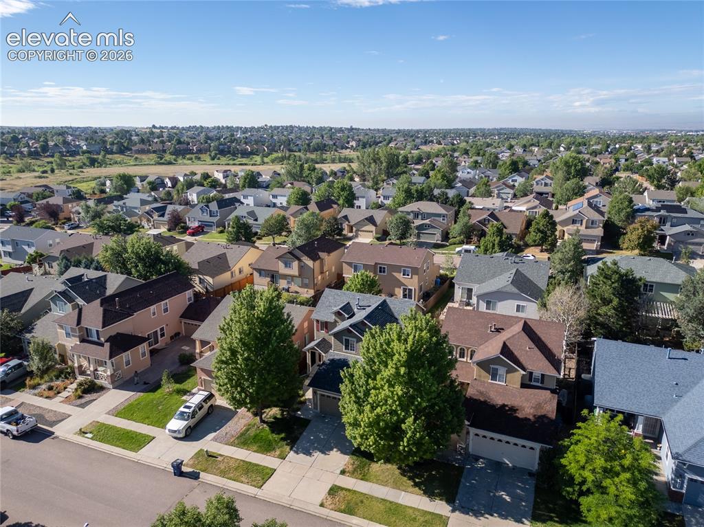 Image 5 of 39: Expansive aerial perspective showcasing a residential neighborhood with var
