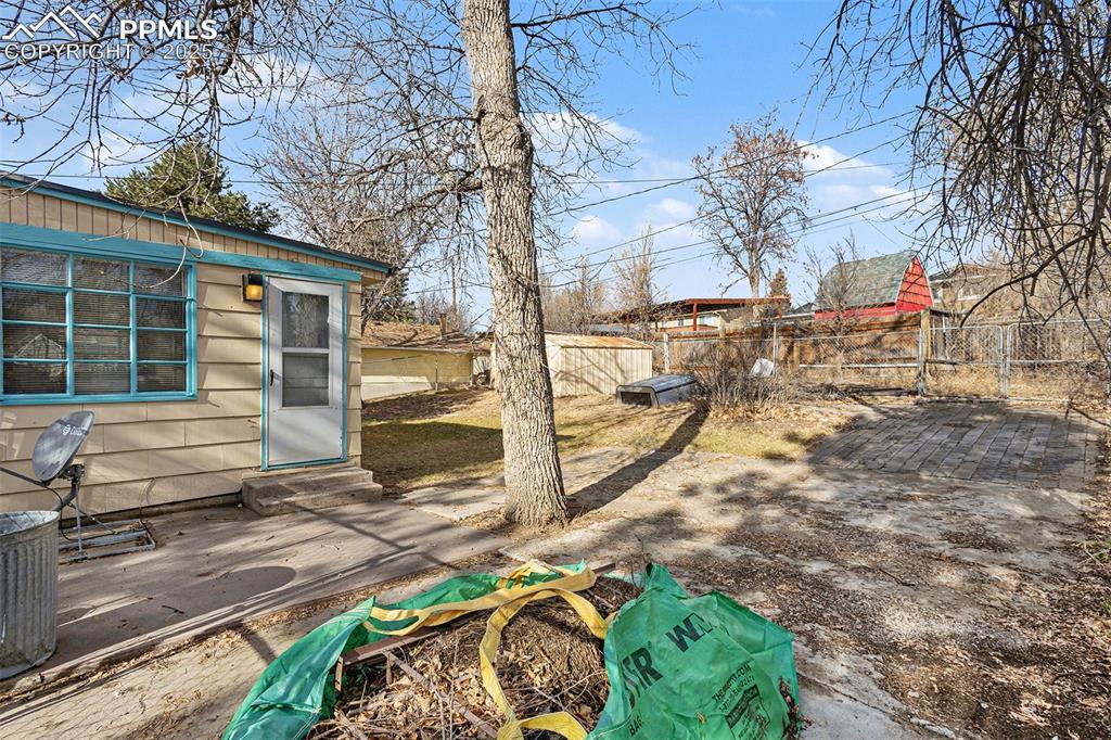 Image 14 of 19: Side of Home w/Driveway