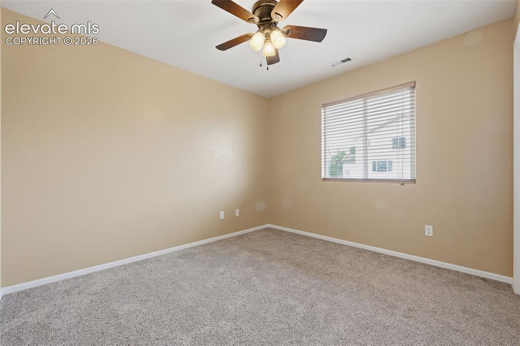 Image 12 of 21: Carpeted interior with neutral wall finish