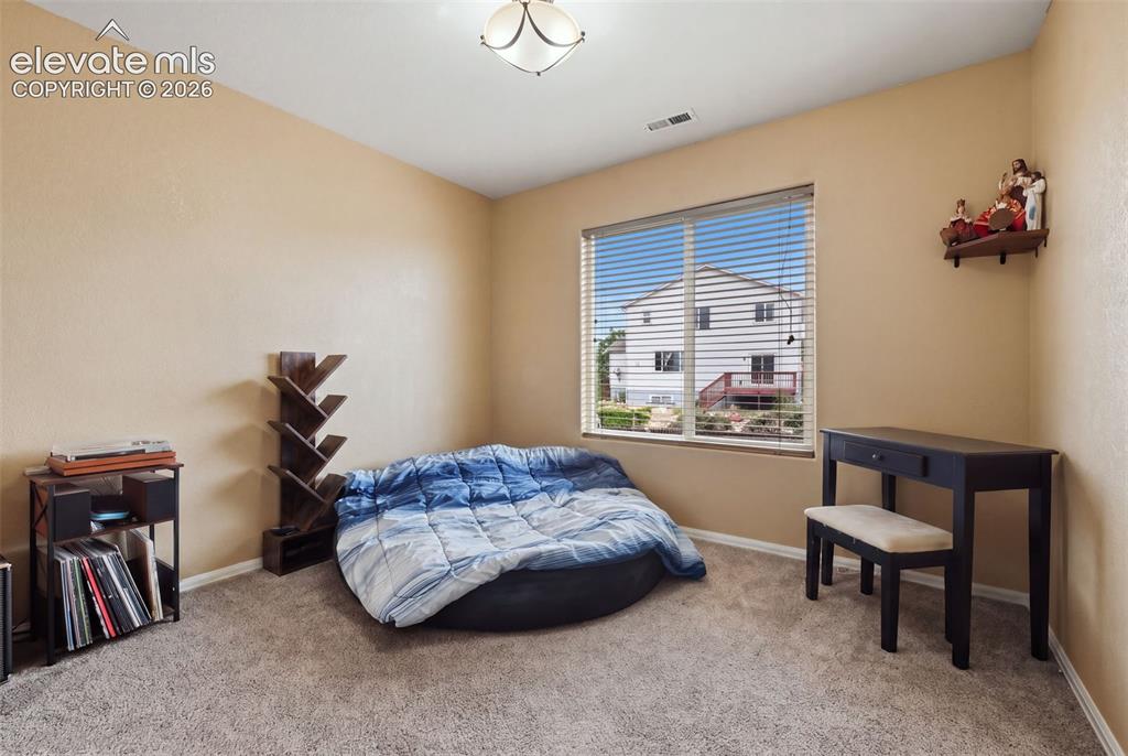 Image 19 of 21: Carpeted flooring, neutral wall tones, recessed ceiling light fixture, and 