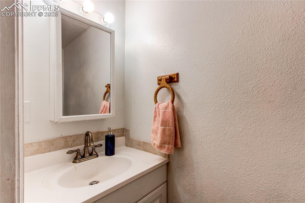 Image 11 of 36: Bathroom featuring vanity