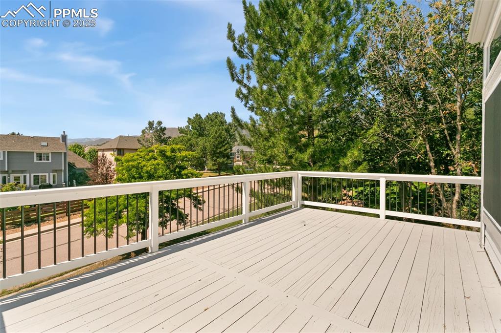 Image 49 of 50: Wooden deck with a residential view