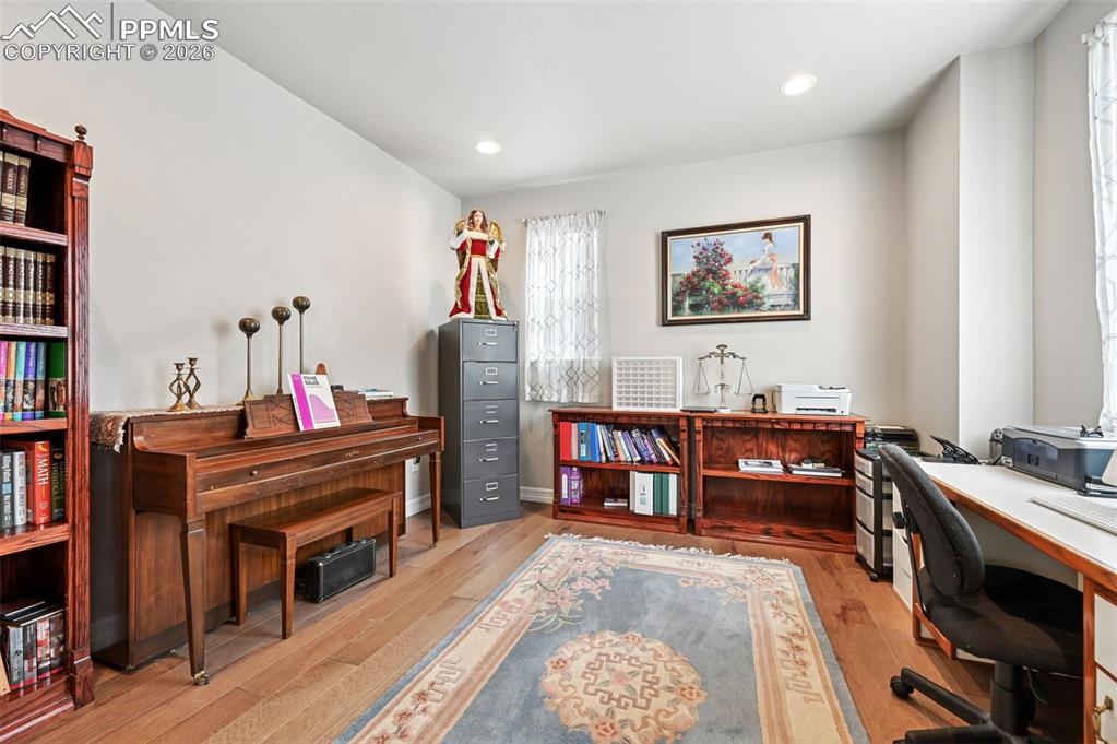 Image 22 of 48: Office tucked behind French doors