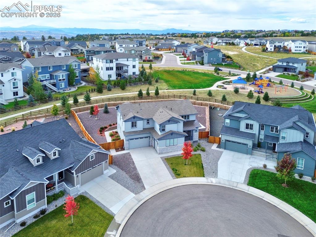 Image 3 of 48: Aerial view of cul de space with green space and playground behind!
