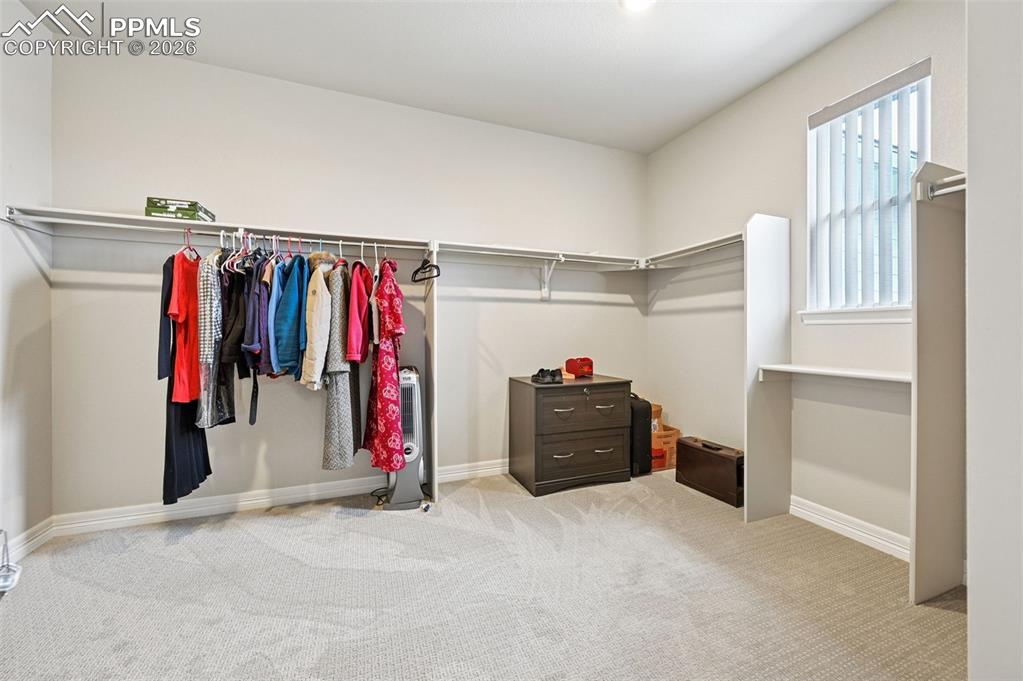 Image 31 of 48: Primary suite large walk in closet