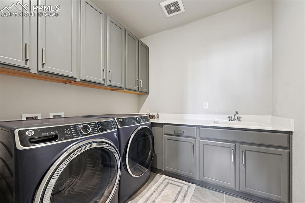 Image 32 of 48: Upstairs laundry room/ wet room