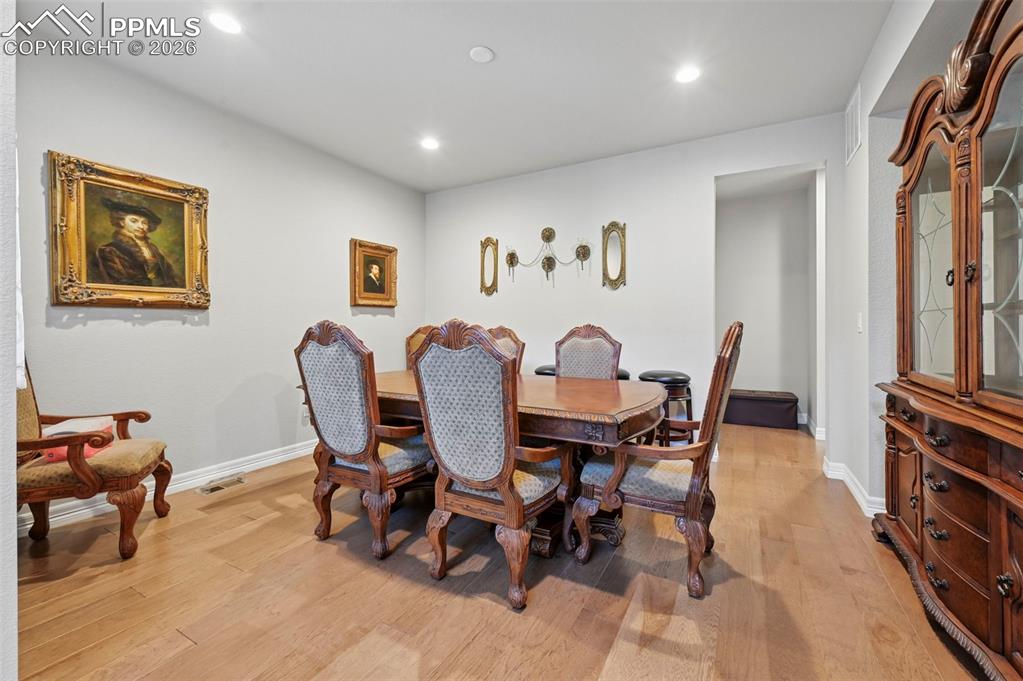 Image 7 of 48: Formal dining room adjacent to entry