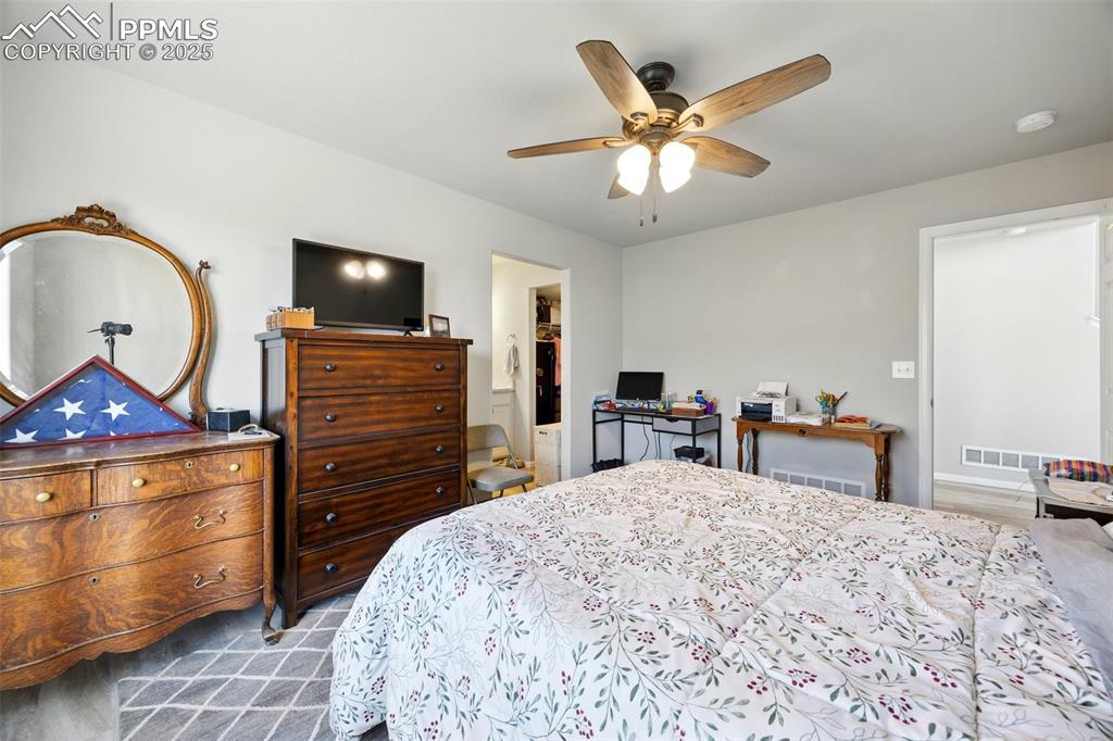 Image 14 of 46: Bedroom with a ceiling fan and a spacious closet
