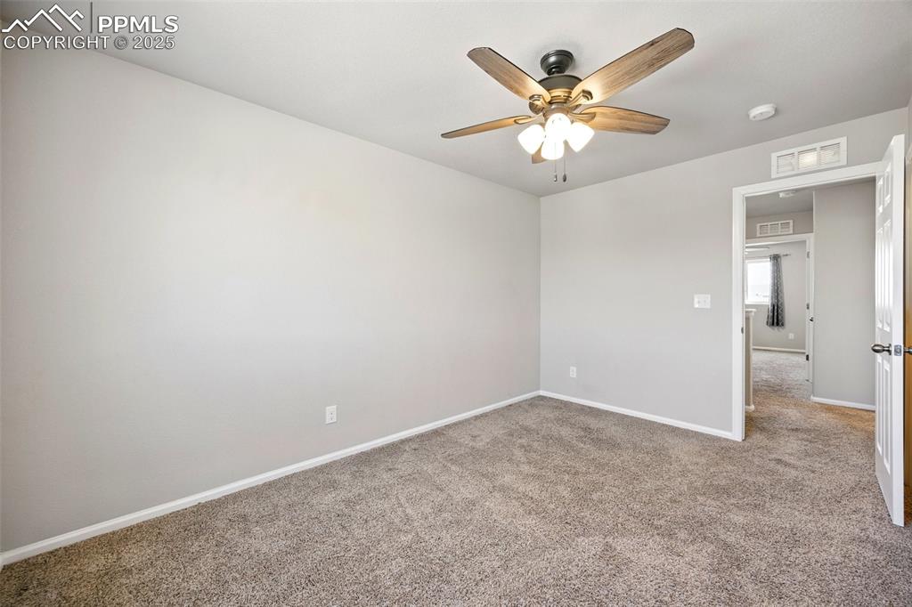 Image 20 of 46: Unfurnished room featuring carpet floors and ceiling fan