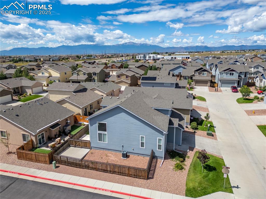 Image 35 of 46: Aerial view of residential area with mountains