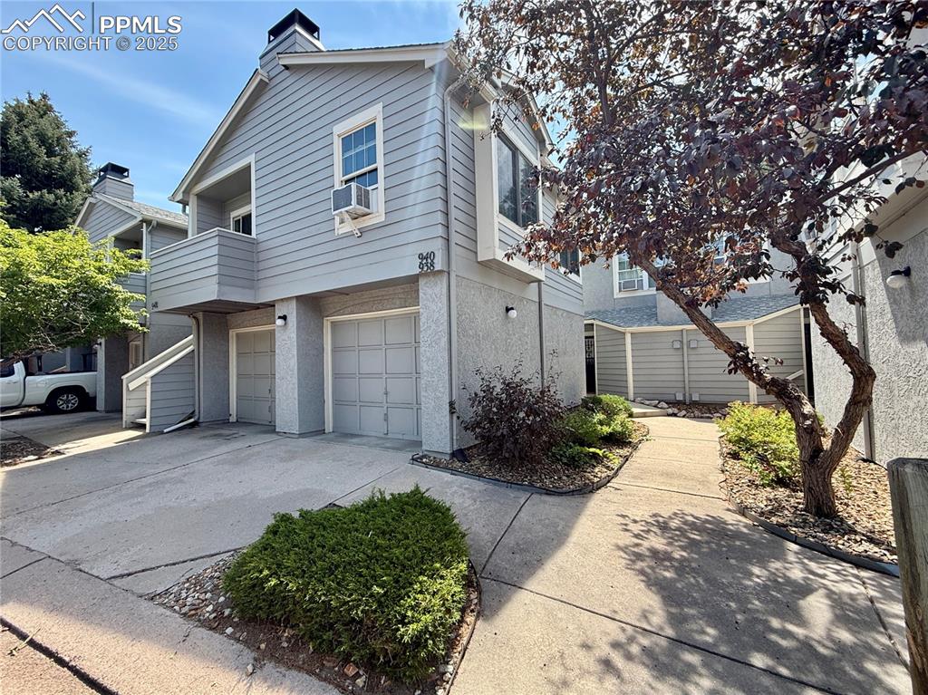 Caption: The outside of the condo building.  The garage for this home is on the right.