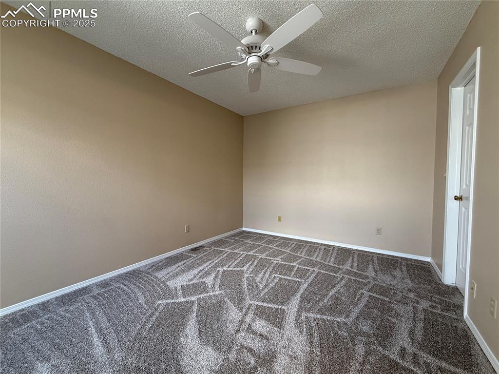 Image 9 of 23: Primary bedroom with en-suite full bathroom and walk-in closet.