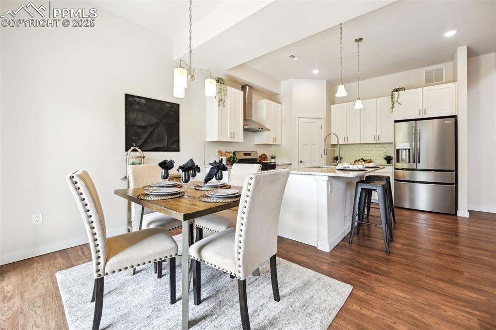 Image 10 of 30: Dining Area located off the Kitchen with slider to the covered backyard pat