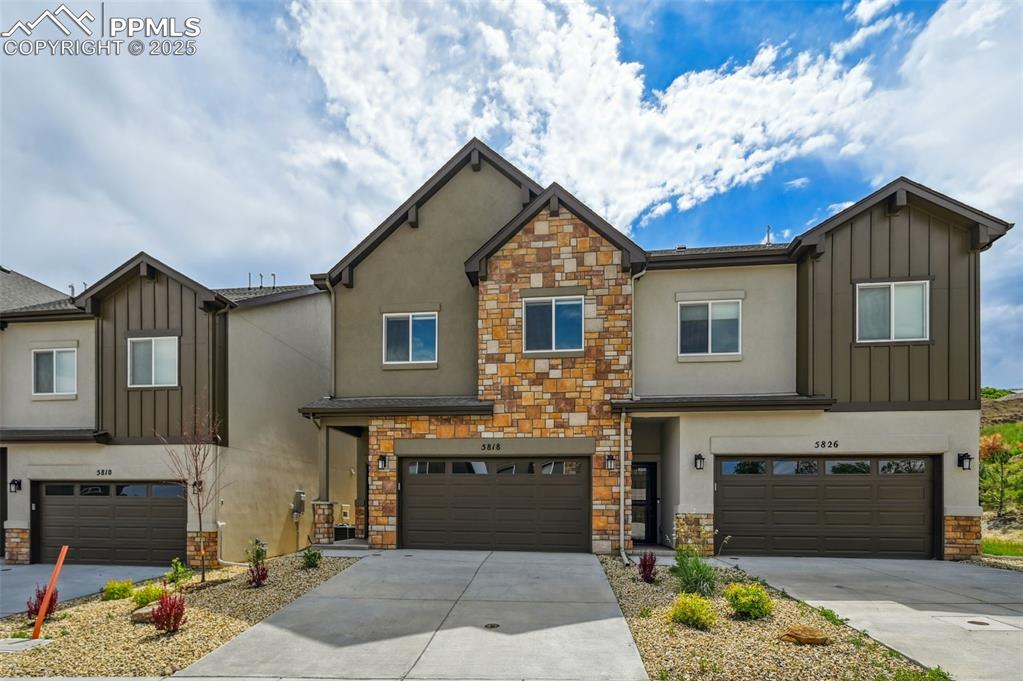 Image 2 of 30: Front views with stucco stone exterior.