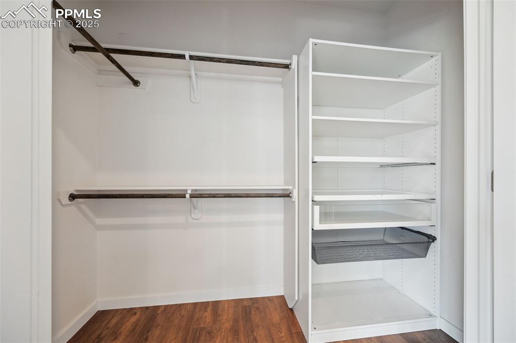 Image 20 of 30: One of two walk in closets in the upper level Primary Bedroom.