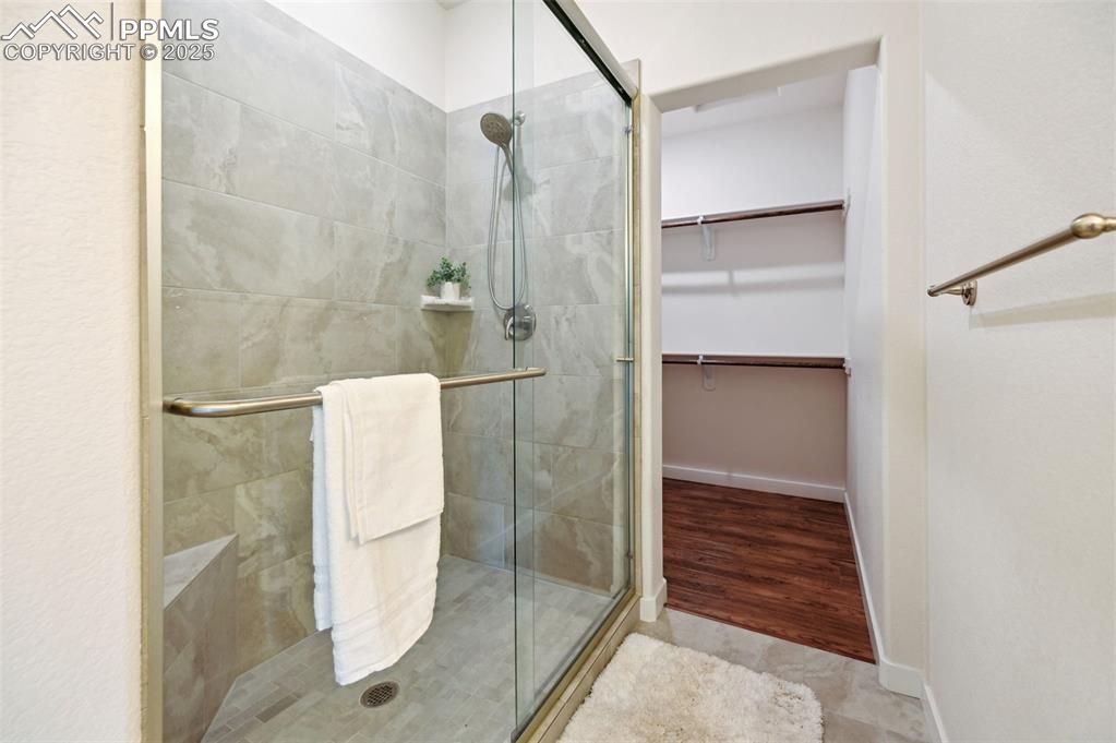 Image 22 of 30: Spa-like Shower Bathroom with enclosed tiled spa shower in the Primary Suit