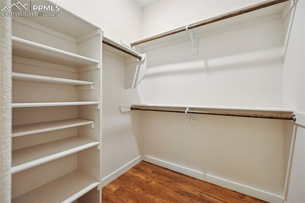 Image 23 of 30: One of two walk in closets in the upper level Primary Bedroom.