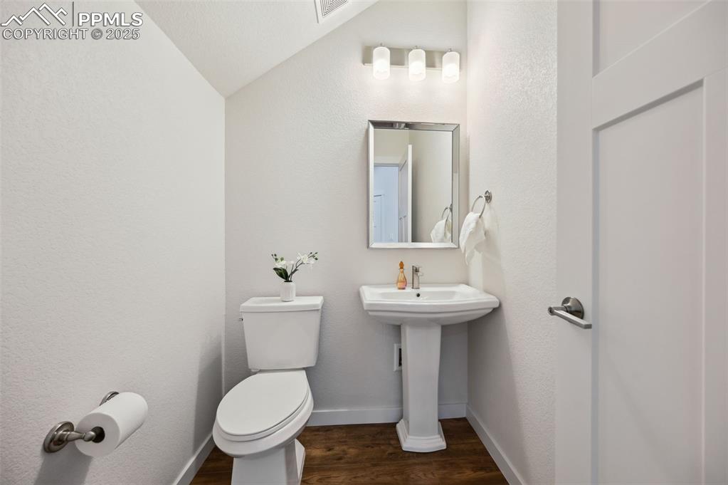 Image 4 of 30: Convenient main level Powder Bathroom for guests.