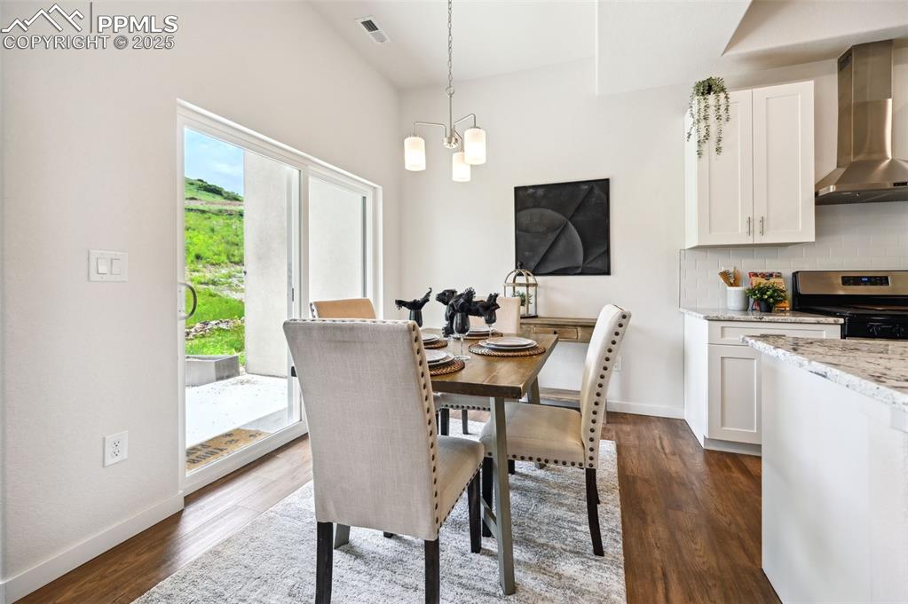 Image 8 of 30: Dining Area located off the Kitchen with slider to the covered backyard pat