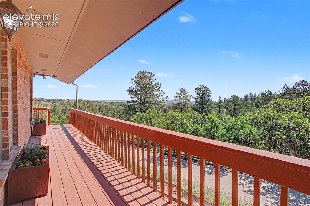 Image 5 of 50: Wrap-around deck in excellent condition with amazing views.