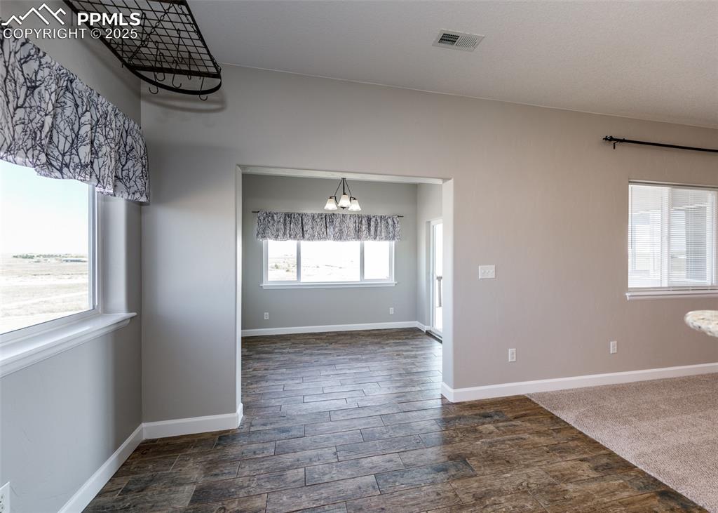 Image 10 of 27: Eat in dining area with bonus sunroom!