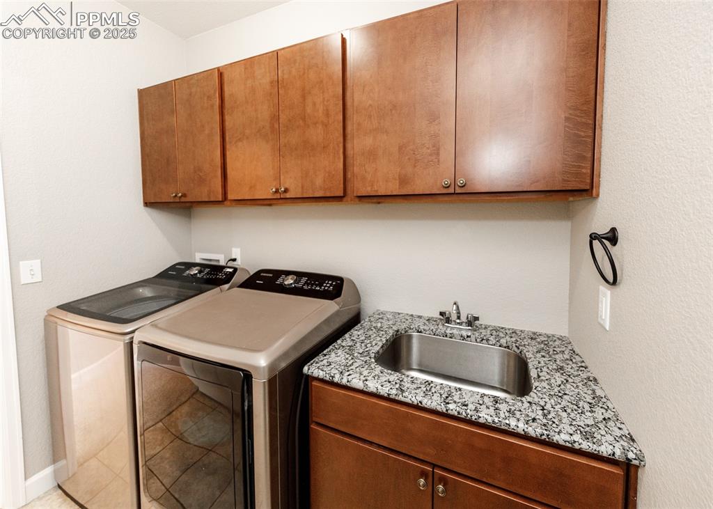 Image 15 of 27: Convenient sink in the laundry area.