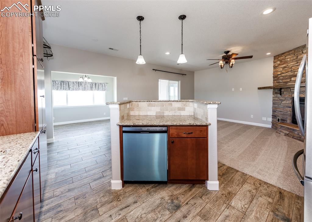Image 9 of 27: Kitchen into family room is perfect for entertaining!