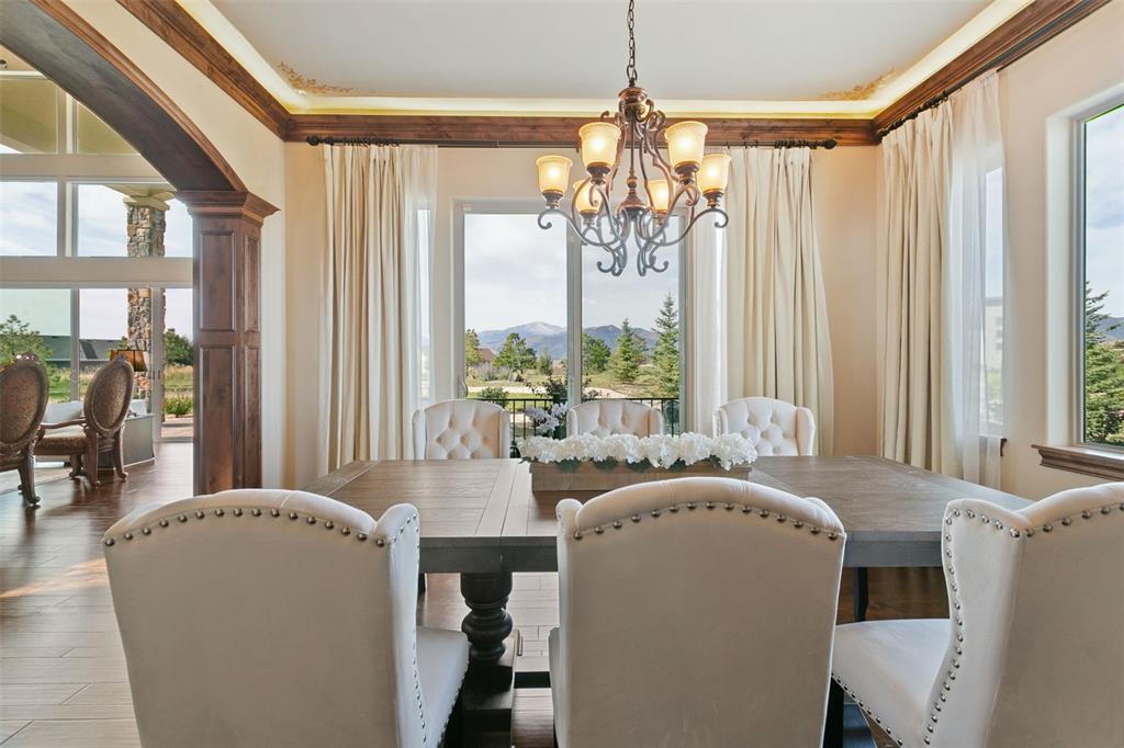 Image 13 of 50: Bright dining room space with serene mountain backdrop