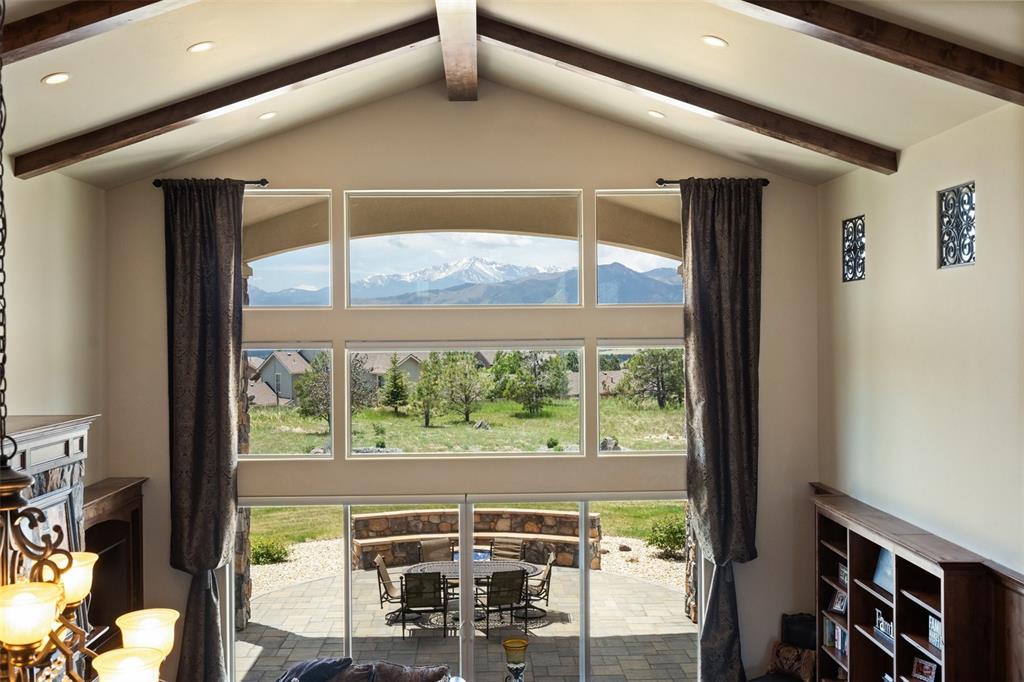 Image 22 of 50: Expansive great-room windows capturing breathtaking Front Range scenery.