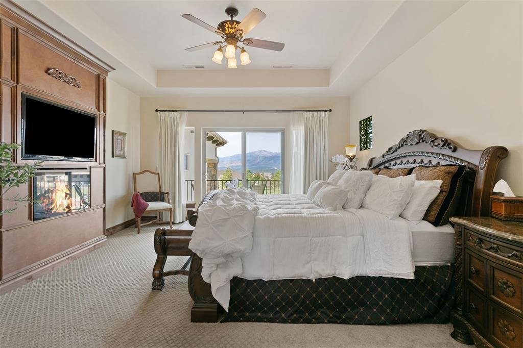 Image 24 of 50: Owner’s suite featuring mountain views, a private balcony, and an electric 