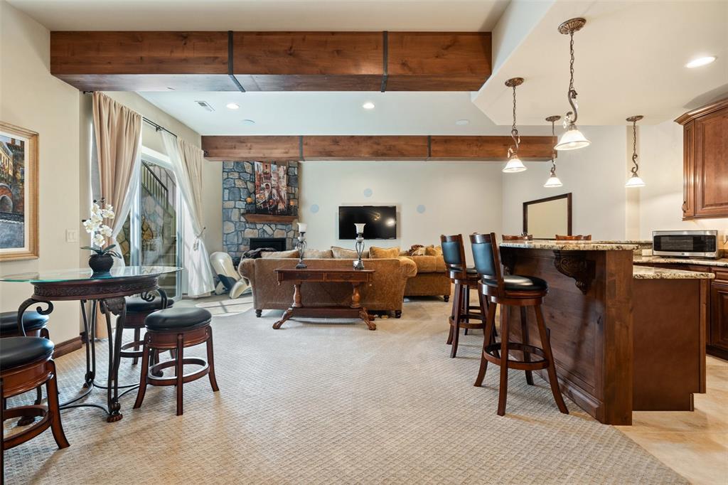 Image 36 of 50: Lower-level entertainment space with 10