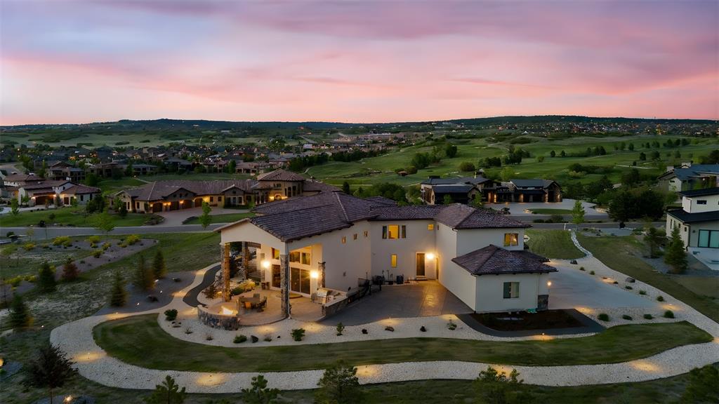 Image 46 of 50: Stunning aerial perspective highlighting the home’s grand outdoor living sp