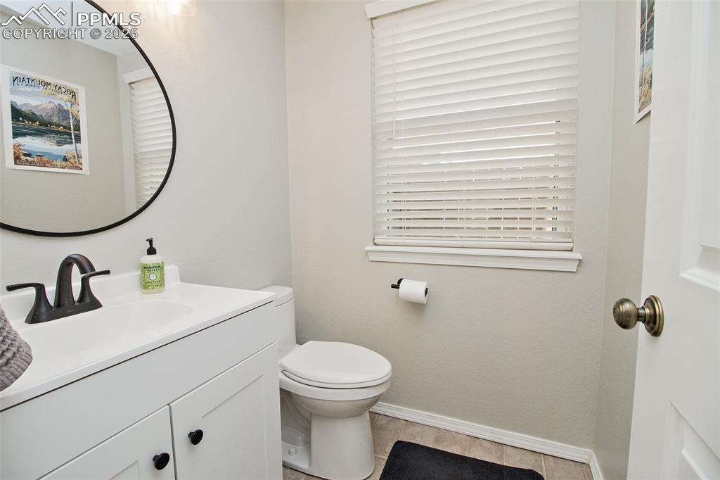 Image 29 of 43: Bathroom with vanity and light tile patterned floors