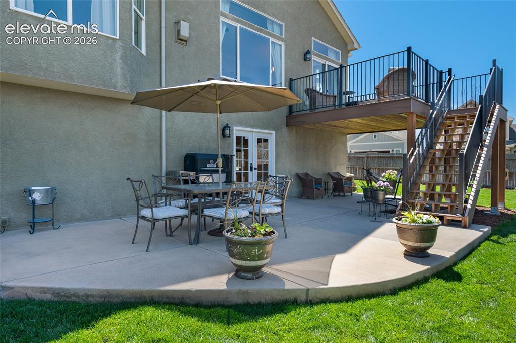 Image 45 of 50: Beautiful patio. Also included is a new composite deck with a gutter system