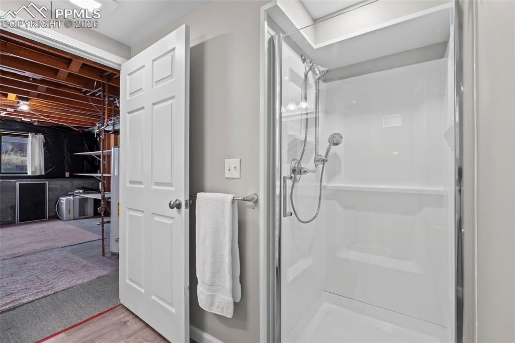 Image 28 of 42: Bathroom with a shower stall