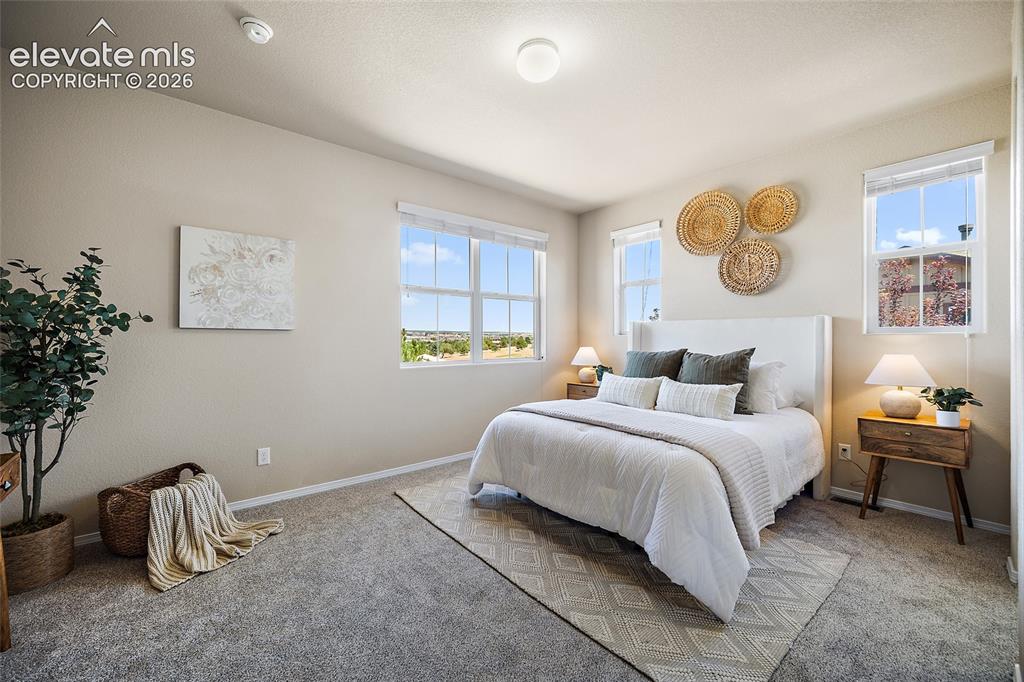 Image 11 of 29: Primary Suite with City and Mountain Views