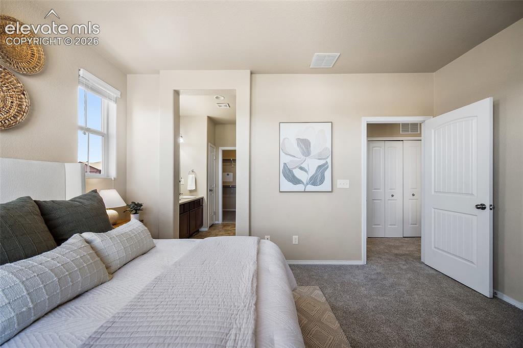 Image 12 of 29: Primary Suite with City and Mountain Views