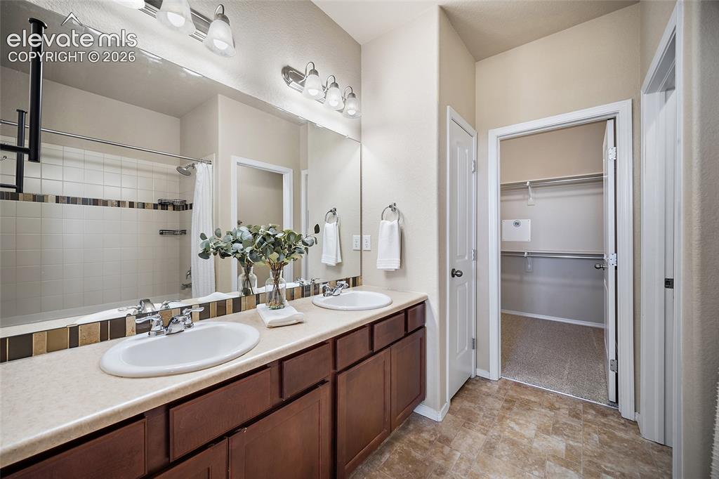 Image 13 of 29: Primary Suite with Large Walk-in Closet