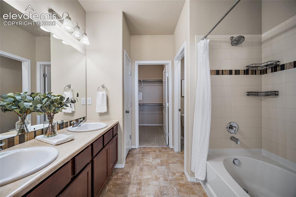 Image 14 of 29: Primary Suite with Large Walk-in Closet