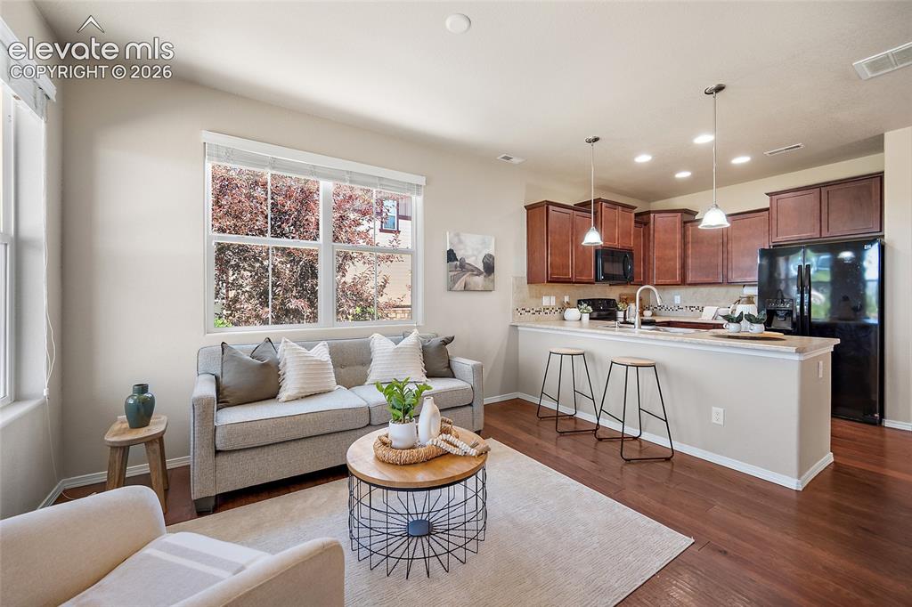 Image 2 of 29: Family Room with City and Mountain Views
