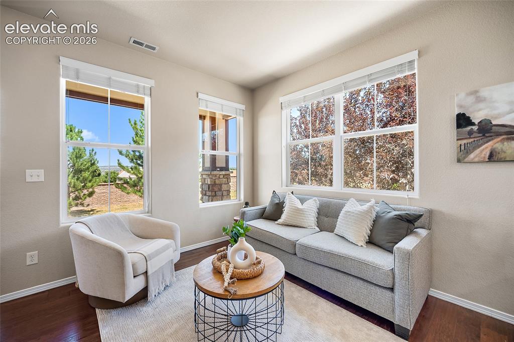 Image 3 of 29: Family Room with City and Mountain Views