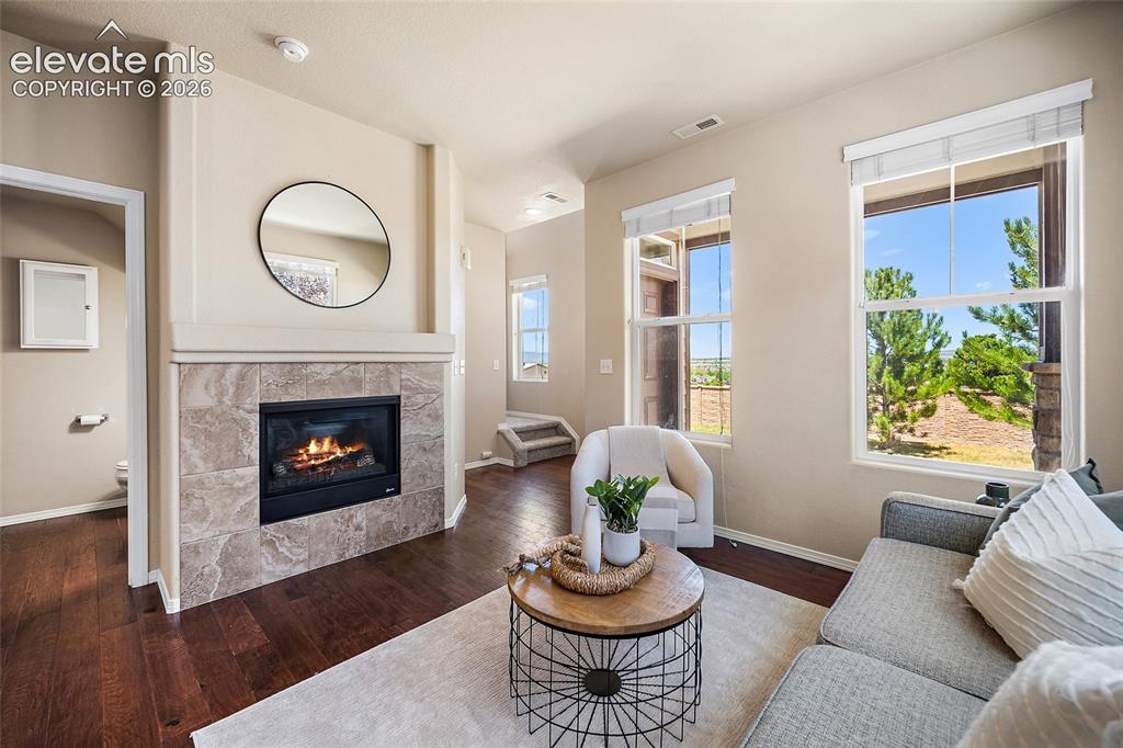 Image 4 of 29: Family Room with City and Mountain Views