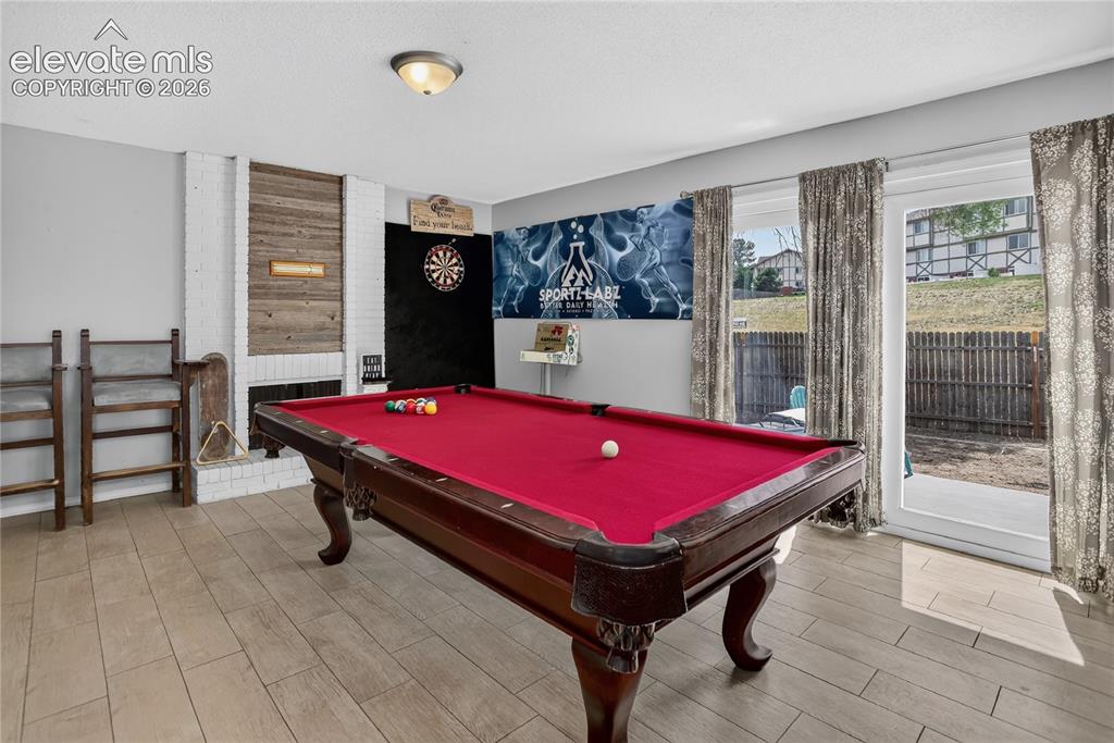 Image 9 of 23: Family room w/ fireplace