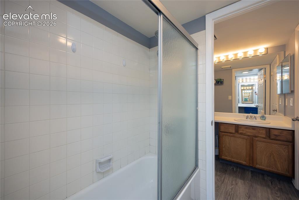 Image 10 of 25: Shower/Tub is shared between Primary Bathroom and Guest Bathroom