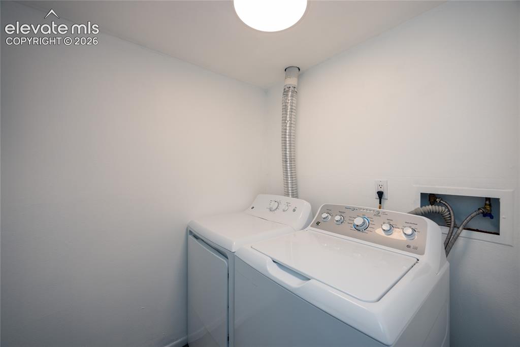 Image 11 of 25: The condo has its own laundry room which includes a washer and dryer.