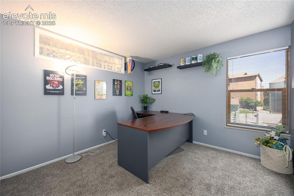 Image 12 of 25: 2nd Bedroom is being used as an office.