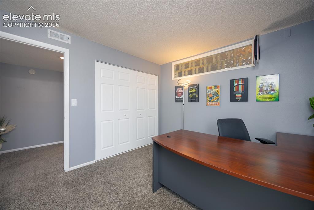 Image 13 of 25: 2nd Bedroom is being used as an office.