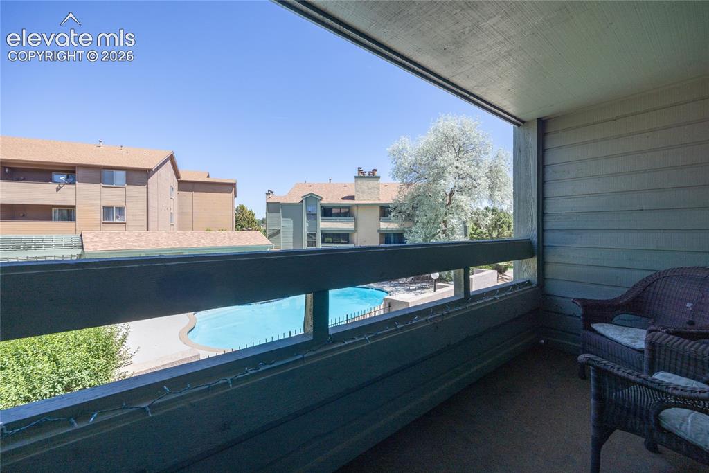 Image 19 of 25: Balcony overlooks the pool area.