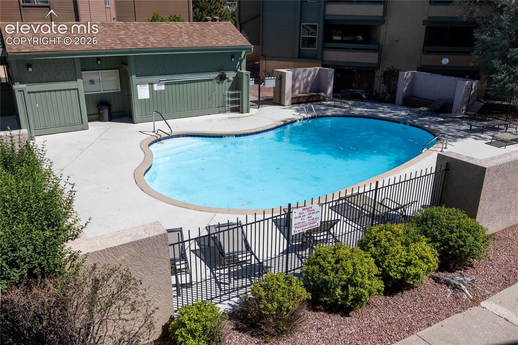 Image 20 of 25: Heated pool and a hot tub.